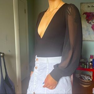 Black bodysuit with sheer long sleeves